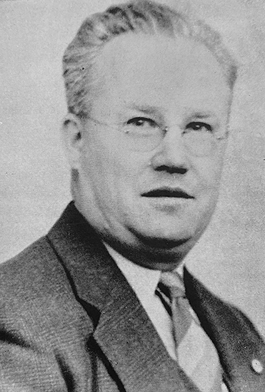 Black and white portrait of Principal Cox.