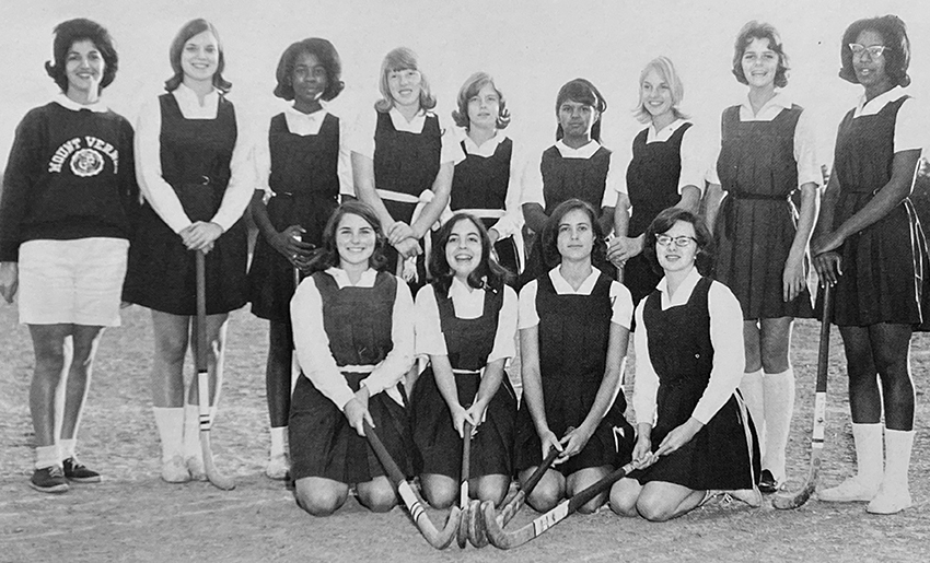 Black and white yearbook photograph of the field hockey team.